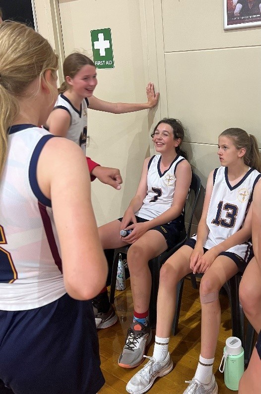 Damascus College Junior Basketballer taking a breather throughout their game.